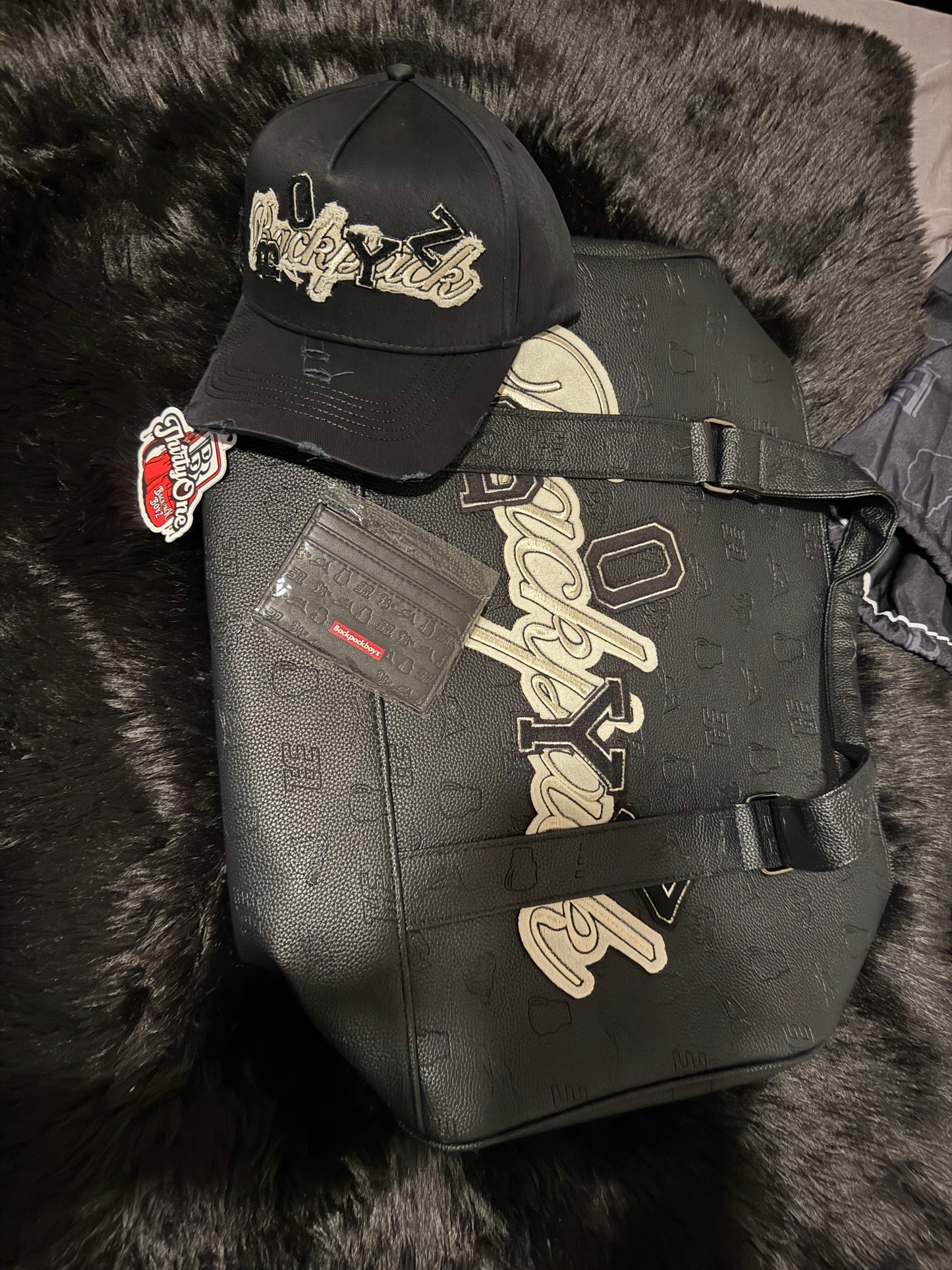 31 hats - hat- Duffle bag and wallet.